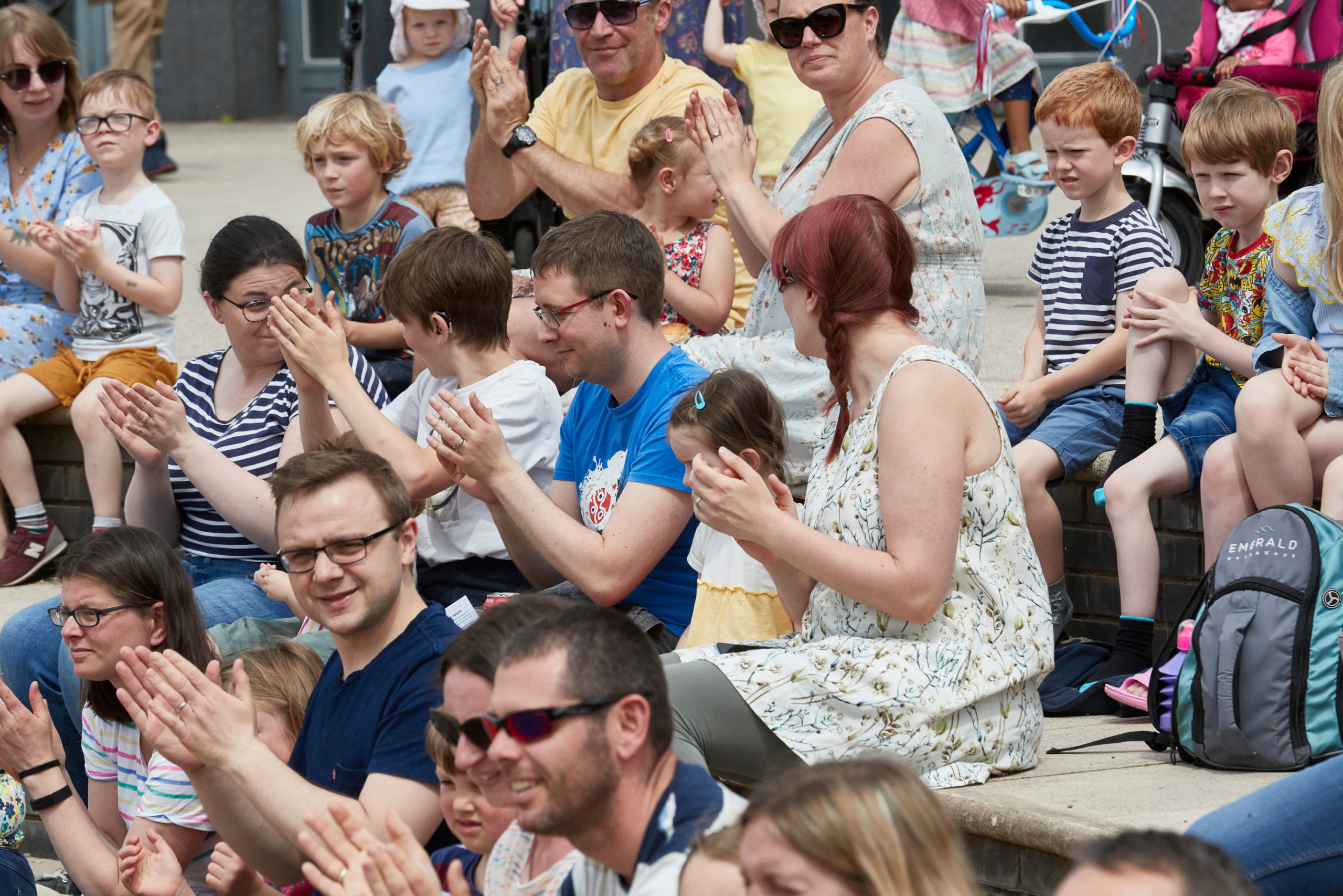 large group of people clapping