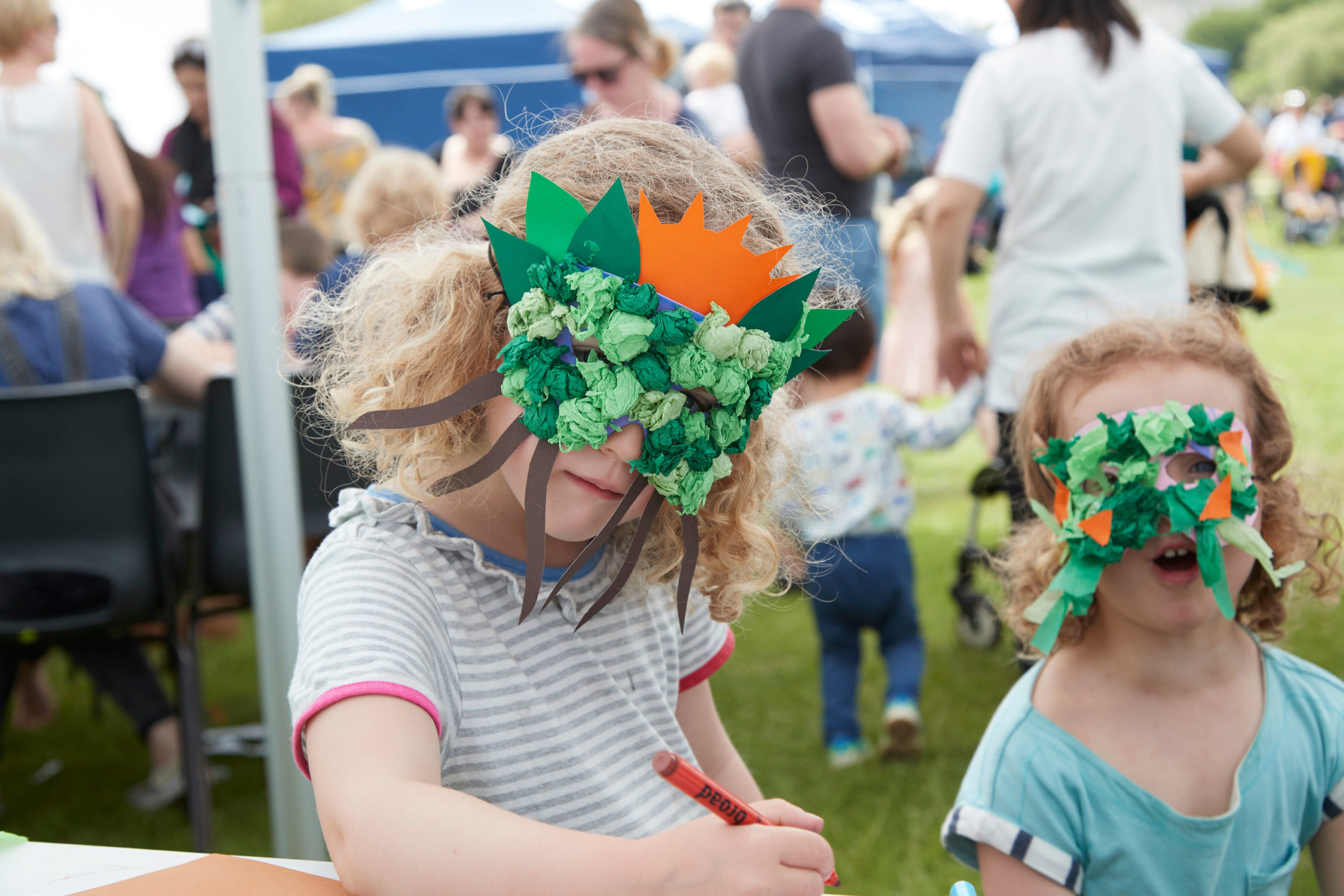 child wearing a hand made face mask from a childrens workshop