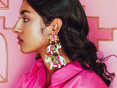 A lady wearing elaborate elephant earring