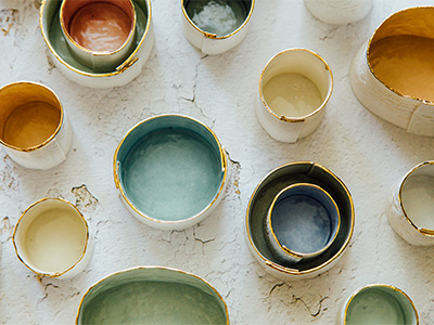 Hand made ceramic posts on a painted white table